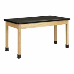 Fixed-height lab table with a black laminate countertop and wood construction. Overall height 30 in, overall length 4 1/2 ft. Suitable for use in educational, industrial, and laboratory settings as a work surface for testing, assembly, or instruction.