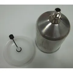 Gravity feed spray gun cup for DeVilbiss series spray guns. Supplies paint via overhead flow for controlled application in industrial finishing, automotive refinishing, and woodworking.