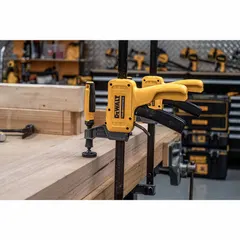 This dual-function trigger clamp and spreader features a grooved jaw pad for secure grip on round or irregular surfaces. With a max jaw opening of 24 in and a working range of 8 in to 31 3/4 in, it is suited for clamping or spreading tasks in woodworking, construction, and metal fabrication. The 2 1/2 in throat depth accommodates a variety of workpiece sizes.