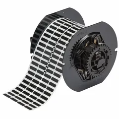 Thermal transfer precut label roll with rubber permanent adhesive. Each label measures 13/64 x 21/32 in. Supplied 10,000 labels per roll. Compatible with i5300 printer series. Used for on-demand identification of industrial equipment, parts, and assets in harsh environments.