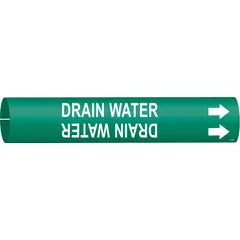 Green snap-on pipe marker with white legend reading 'Drain Water' and directional arrows. Fits pipe outer diameters from 4 to 6 inches. Used to identify drain water lines in industrial piping systems, aiding in compliance with pipe-labeling standards.