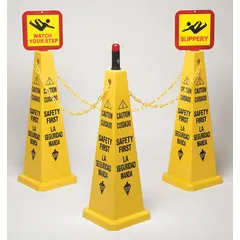 This barricade system includes three yellow safety cones (26 in x 10-9/10 in) with Caution Safety First messaging, two message boards with four labels (Slippery, Watch Your Step), one 20 ft yellow plastic chain, and one red LED flashing cone light topper. Used to mark hazards and direct foot traffic in industrial and construction environments.