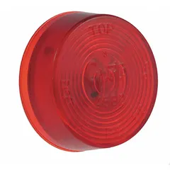 Round red incandescent clearance light with bracket/grommet mount and PL-10 connector. SAE PC lens code. Used on trucks, trailers, and heavy equipment to mark vehicle width and height.