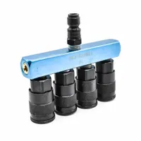This rectangular aluminum block manifold provides one inlet and four outlets for distributing air or fluid in pneumatic or fluid systems. It is used to consolidate supply lines and simplify routing to multiple points in control panels or lubrication setups