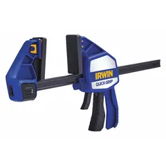 This dual-function trigger clamp and spreader has a 12 in max jaw opening, a throat depth of 3 3/4 in, and a clamping range from 9 1/4 in to 20 7/8 in. The full-faced flat jaws distribute clamping pressure evenly. It is used for holding workpieces during gluing, assembly, or repair in woodworking, cabinetry, and general construction.