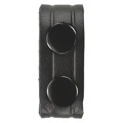 This belt keeper is made of plain synthetic leather in black, with a snap closure. Each pack contains 4 pieces, each 7/8 inch wide. It is used to secure loose belt ends on work trousers or uniforms, preventing snagging on machinery in industrial, maintenance, and warehouse settings.