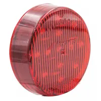 This red LED clearance light features a round, surface-mount design with a grommet mount and pigtail electrical connection. It is IP67 rated and carries an SAE P2 lens code, suitable for use on heavy-duty vehicles to indicate width and position