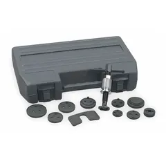 This steel brake caliper set is used to push back brake pistons that are mechanically tied to the parking brake during brake pad replacement. The set includes an applicator and pad for controlled piston retraction.