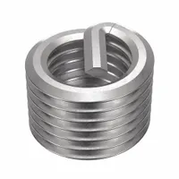 This tanged helical insert is designed for thread repair or reinforcement in metal components. Made from 18-8 stainless steel with a plain finish, it features a 1 1/8"-7 coarse thread and right-hand direction. The screw-locking design provides resistance to vibration loosening. Tensile strength ranges from 200,000 to 250,000 psi. Suitable for use in machinery, automotive, and industrial equipment where high-strength threads are required