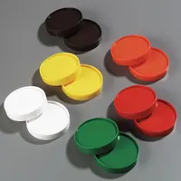 This polyethylene pourer container lid in green has an overall height of 3/4 inch and includes caps. It is designed for use with pourer containers in foodservice settings for storing and dispensing condiments, oils, and syrups