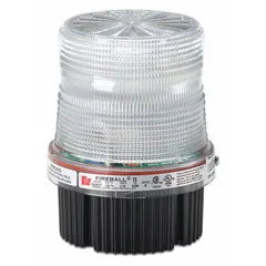 This wired strobe light features a clear lens and operates on 24V DC. It has a threaded mount with a 1/2 in NPT connection, an overall diameter of 4 1/8 in, and an overall height of 5 1/4 in. Typical applications include visual warning in industrial settings such as factories and warehouses, as well as alarm systems and equipment status indication.