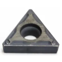Triangle (T) indexable turning insert for turning operations on metal workpieces. Available in two geometry variants: TCMT21.51EFP and TCMT110204N-FP. Used in general machining and industrial manufacturing applications requiring repeatable indexing