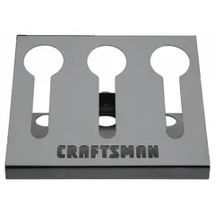 This magnetic tool holder is constructed from steel with a gray finish. It measures 11-5/8 inches in overall width and length. The magnetic mounting allows attachment to steel surfaces for organizing cordless drills and other magnetic tools in workshops or job sites.