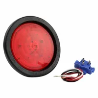 Red LED stop light with round shape, 4 5/16 in overall diameter and height. Features grommet mount for permanent installation and female pin electrical connection. Used on trucks, trailers, and heavy equipment for brake signaling