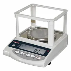Electric-powered industrial balance with 0.1 g readability and weighing in ounces. Features a 6 1/4 in x 7 in platform and RS-232 connection for data transfer. Not IP rated or washdown rated. Suitable for precision weighing in manufacturing, laboratory, and quality control applications.