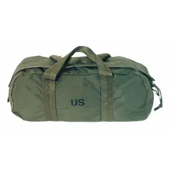 This olive cotton duck canvas tool bag features a wide-mouth opening for easy access and two exterior pockets for organizing small parts and fasteners. Dimensions: 6 inches wide, 19-1/2 inches deep, 8-1/2 inches high. Suitable for carrying hand tools in maintenance, construction, and industrial settings.