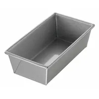 Single-slot open top bread pan made of aluminized steel in a silver finish. Overall width 5 in, overall depth 2 3/4 in. Suitable for baking bread loaves in commercial or home kitchens