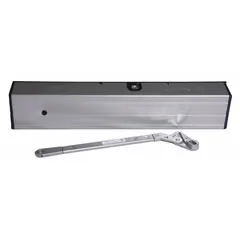 This LCN high energy door operator is designed for heavy-traffic interior applications. It measures 19 in length, 2 9/16 in width, and 3 1/2 in height, with an aluminum painted finish. The non-hold open closer operates on 24 VDC and is suitable for automatic door opening and closing in commercial or institutional settings.