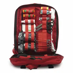 Red nylon backpack trauma kit containing 506 components: 100 adhesive bandages (1 in x 3 in), 10 gauze pads (2 in x 2 in), 10 sting and bite wipes, 20 ammonia inhalants, 5 pairs of nitrile gloves, and 6 scalpel blades. No medication included. Suitable for emergency medical response in industrial, construction, and remote work sites.
