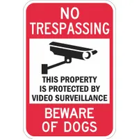 Aluminum sign with mounting holes for permanent installation. Features Diamond Grade retroreflective sheeting for high visibility at night. Displays the message 'This Property Is Protected By Video Surveillance Beware Of Dogs'. Suitable for perimeter security on commercial or industrial properties