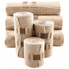 Sterile, self-adhering elastic bandages made from cotton, 6 inches wide and 5 yards long. Each box contains 50 unitized bandages with clips for secure fastening. Latex-free and beige in color, these bandages are not water resistant. Suitable for wound care, compression, and securing dressings in first aid settings.