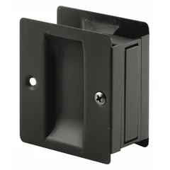 This PRIME-LINE pocket door pull handle features a tray/lever style made from brass with an aged bronze finish. It has unthreaded holes for mounting, suitable for use on pocket doors, sliding doors, or cabinetry where a low-profile pull is required.