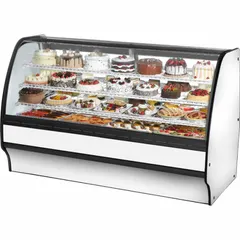 This curved glass refrigerated merchandiser from the TGM series is designed for commercial retail display of chilled beverages and perishable foods. It measures 49 1/8 in x 77 1/4 in x 39 in, features a white finish and curved glass front to maximize product visibility, and uses R-290 refrigerant for consistent temperature maintenance.