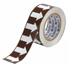 Non-reflective vinyl pipe marking tape with brown background and white legend text. Supplied in a 90 ft roll with 2 in width. Used for identifying pipe contents and indicating directional flow in industrial piping systems.