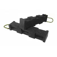 Plastic rectangular cribbing block with 40-ton vertical load capacity and 18-inch overall length. Black body with yellow handle for positioning. Used for stabilizing heavy loads during lifting, rigging, or maintenance operations