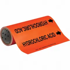 Adhesive pipe marker on a roll for identifying pipes carrying hydrochloric acid. Orange background with black legend text and directional arrows. Fits pipe outer diameters from 2-1/2 to 6 inches. Each roll contains 30 markers.