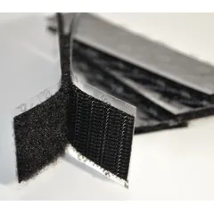 Pre-cut hook-and-loop strip made of black nylon, 2 inches wide by 4 inches long. Used for bundling, mounting, and closure applications such as cable management, panel attachment, and temporary fixture securing.