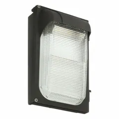 This LED full-size wall pack delivers 134 lumens at 5000K with Type III distribution, consuming 22 W. It operates on 120 to 277V AC and has a 12 in overall height with a bronze finish. Suitable for outdoor area lighting such as building perimeters, entrances, and parking areas.