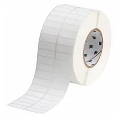 Thermal transfer precut label roll measuring 1/2 in by 1 1/2 in. Features a rubber aggressive adhesive with permanent bonding, suitable for industrial labeling on challenging surfaces. Compatible with BBP11 printer series for facility and safety identification applications.
