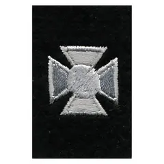 Rank insignia patch with a silver cross on black background. Measures 3/4 in. Constructed from polyester/rayon blend. Suitable for attachment to uniforms in security, law enforcement, or military contexts.
