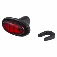 This LED clearance light features a red oval lens with a PC SAE rating and a grommet mount for installation in a standard hole. It is used on trailers, trucks, and heavy equipment to mark vehicle width and height, providing long-life illumination