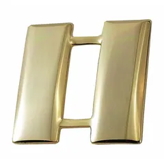 Metallic rank insignia denoting the rank of Captain. Features a smooth bar design in gold finish, measuring 1 inch. Constructed from metal with a pin and safety catch attachment for secure fastening to uniform collars or lapels.
