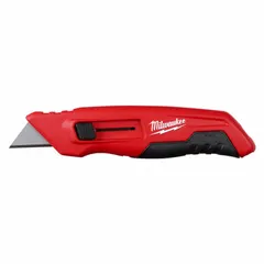 This retracting utility knife features a steel standard tip, rubberized grip, and metal body in red. The blade retracts via a button mechanism. Suitable for cutting cardboard, drywall, plastic strapping, and other general-purpose materials in construction, warehousing, and maintenance tasks.