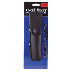 This black nylon pouch features a snap closure and is designed to hold a flashlight. It provides a secure carry solution for hands-free access on a belt or gear.