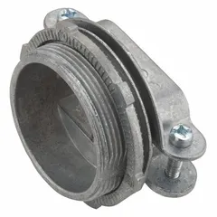 This threaded metal connector is made of die cast zinc with a silver finish. It has a 1 1/4 in trade size, clamp style, and 1 5/16 in overall length. Used to terminate and secure oval cable in conduit systems, providing strain relief and grounding in electrical installations.