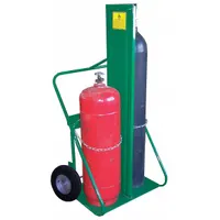 Side-by-side hand truck for transporting two gas cylinders. Green finish, chain securing mechanism, 24 in W x 13 in D nose plate. 400 lb capacity. Used in industrial welding environments for moving compressed gas cylinders