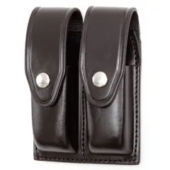 Black leather magazine pouch with basket weave texture and snap closure. Designed for duty use, it securely holds a standard spare magazine for quick access during law enforcement, security, or military operations.
