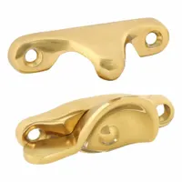 This window latch is a sweep lock designed for sash windows. It mounts on the frame to secure the window in a closed position. The latch has a brass-plated finish and an overall length of 2 1/2 inches. Handle is not included