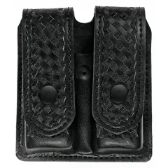 Synthetic leather pouch with basket weave finish. Measures 5 1/2 inches by 1 3/8 inches. Designed for carrying spare magazines on a duty belt.