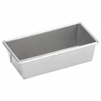 Single-slot open top bread pan made of aluminized steel with a silver finish. Overall width 3 5/8 in, overall depth 2 1/4 in. Suitable for baking single loaves of bread in commercial or home kitchens