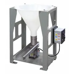 Volumetric feeder machine with a feed rate of 4,000 lb/hr. Trough dimensions: 20 in length, 4 in width. Discharge height: 7 3/4 in. Used for controlled metering of bulk materials in industrial processing lines.