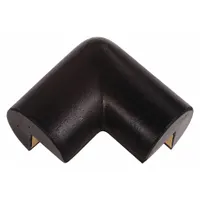 Round-shaped corner protector made of black polyurethane foam with adhesive backing. Overall length 5 inches, thickness 1 inch. Designed to cushion impacts on exposed corners in industrial and commercial settings, reducing injury risk and preventing damage to walls or equipment