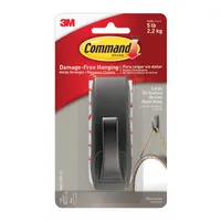 Indoor decorative and utility adhesive-backed hook for hanging lightweight items such as robes, towels, or loofahs. Bronze finish, 1 point per hook, overall height 1 5/8 in. Includes 2 adhesive strips per hook. Supports up to 5 lb