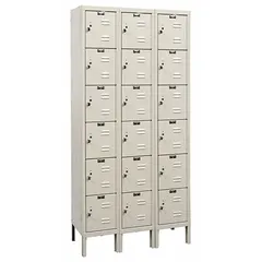 This assembled louvered metal box locker features 6 tiers and is 3 units wide, providing multiple individual storage compartments in a compact footprint. The louvered doors allow ventilation, and each compartment includes a padlock hasp for user-supplied locks. Number plates are included for identification. Finished in tan, suitable for schools, gyms, and workplaces.