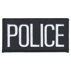 This embroidered insignia measures 4 inches by 2 inches and features black and white lettering on a white plastic base. It is designed to be sewn onto the chest area of uniforms. Typical applications include identification on law enforcement, security, or tactical uniforms.