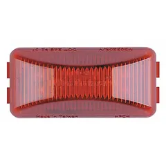 LED rectangular clearance light for surface mounting with a red lens and pigtail electrical connection. Features a hole mount design and SAE P2 lens code. Used on trucks, trailers, and heavy equipment for marking vehicle width and height.